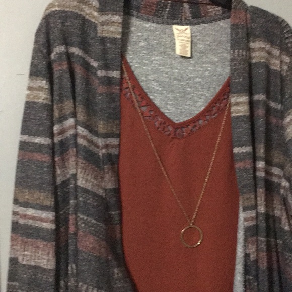 A dress shirt  with necklace attached to it - Picture 2 of 2